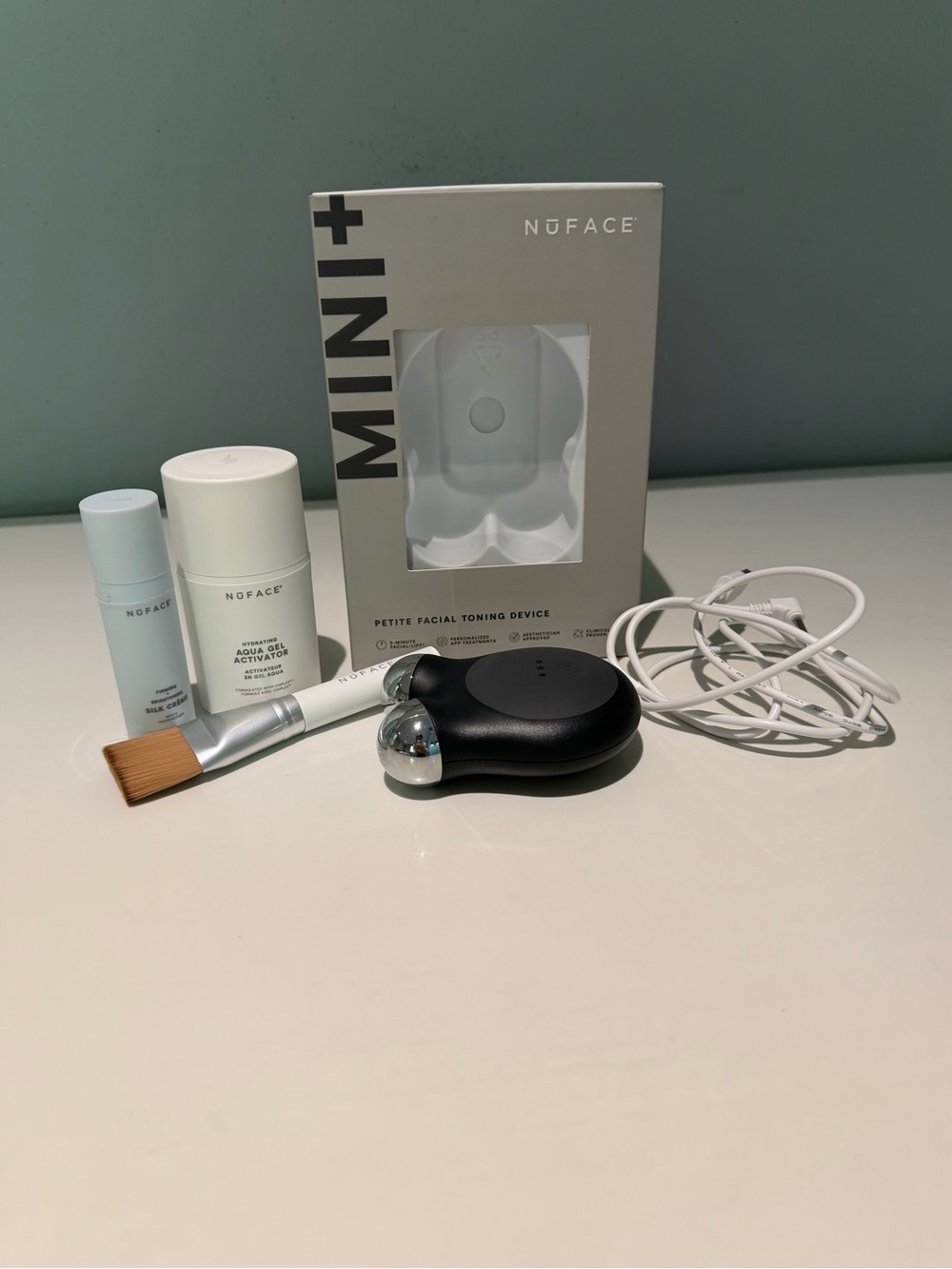 NuFACE Mini+ Petite Facial Toning Device in Black with White Accessories